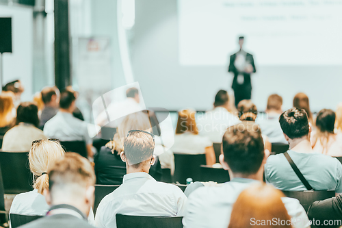 Image of Business speaker giving a talk at business conference event.