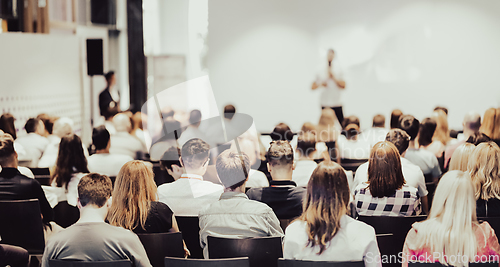 Image of Business speaker giving a talk at business conference event.