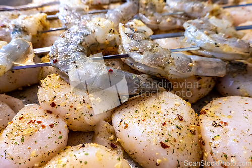 Image of raw scallops and shrimp prepared for party