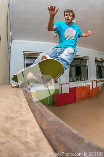 Image of Skateboarder performing a pivot grind