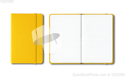 Image of Yellow closed and open lined notebooks isolated on white