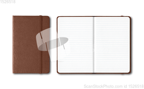 Image of Dark leather closed and open lined notebooks isolated on white