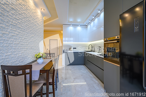 Image of Luxury white and dark grey modern kitchen interior