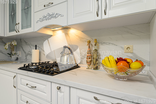 Image of White kitchen in classic style, front view