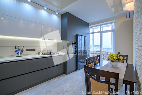 Image of Luxury white and dark grey modern kitchen interior