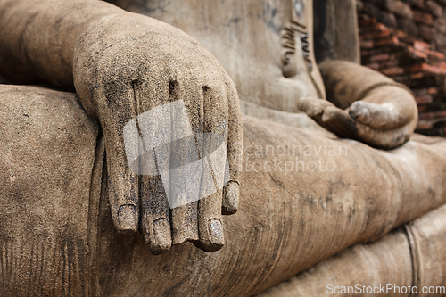 Image of Buddha statue hand close up detail