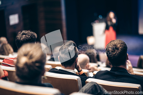 Image of Woman giving presentation on business conference event.