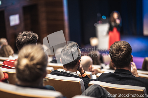 Image of Woman giving presentation on business conference event.