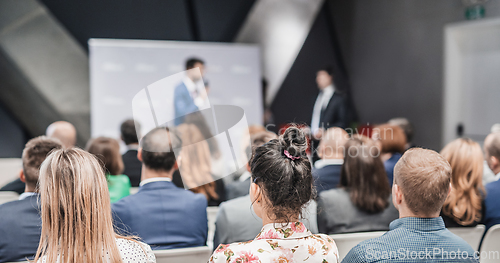 Image of Pitch presentation and project discussion at business convention or team meeting. Audience at the conference hall. Business and entrepreneurship symposium.