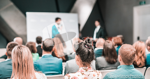 Image of Pitch presentation and project discussion at business convention or team meeting. Audience at the conference hall. Business and entrepreneurship symposium.