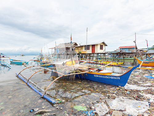 Image of Filipino fishing boat in a sea of junk