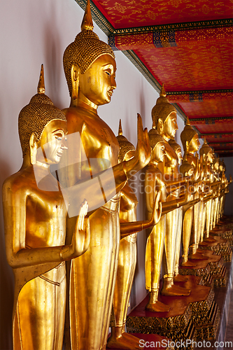 Image of Standing Buddha statues, Thailand