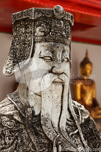 Image of Wat Pho stone guardian face close up, Thailand