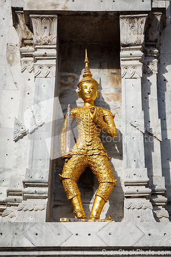 Image of Gold guard on tower, Wat Phi, Thailand