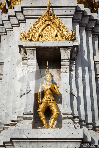 Image of Gold guard on tower, Wat Phi, Thailand