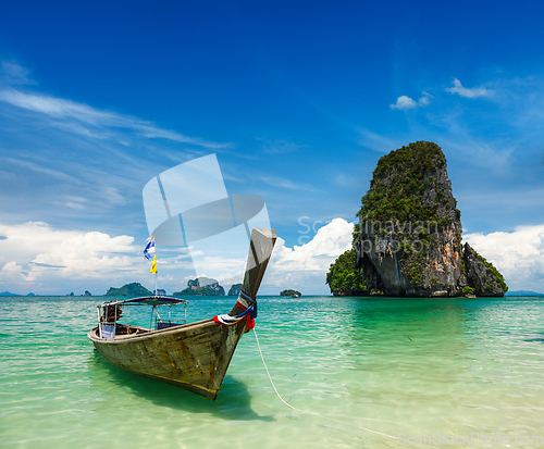 Image of Long tail boat on beach, Thailand