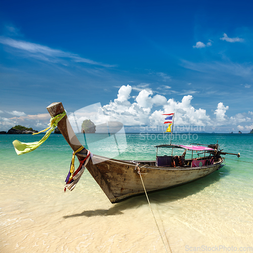 Image of Long tail boat on beach, Thailand