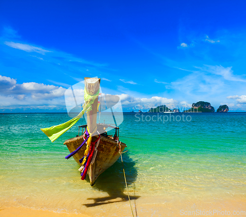 Image of Long tail boat on beach, Thailand