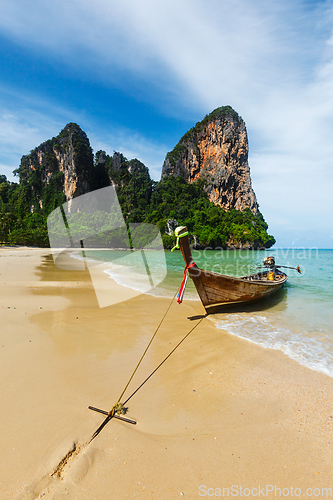 Image of Long tail boat on beach, Thailand