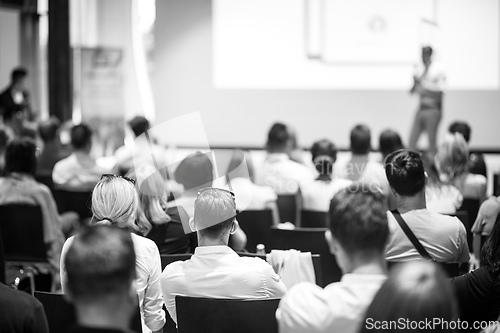 Image of Business speaker giving a talk at business conference event.