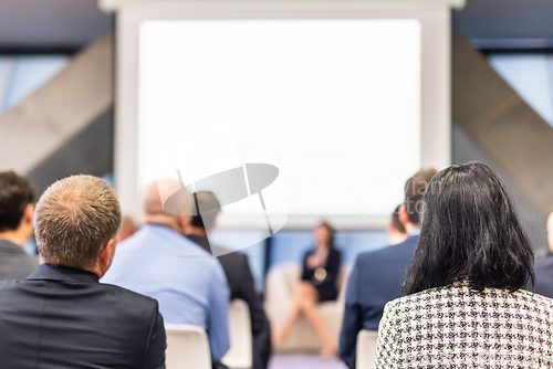 Image of Woman giving presentation on business conference event.