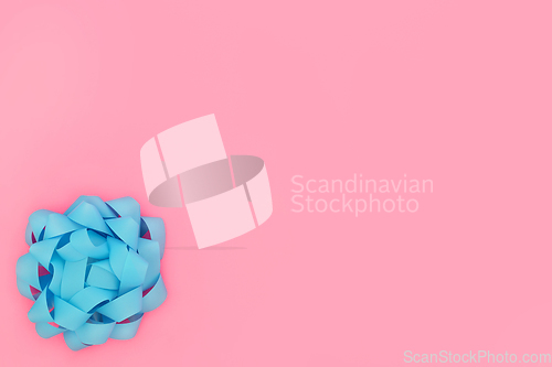 Image of Blue Rosette Bow on Contrast Pink Background