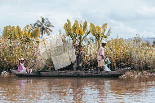 Image of Native Malagasy fishermen fishing on river, Madagascar