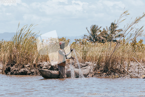 Image of Native Malagasy fishermen fishing on river, Madagascar