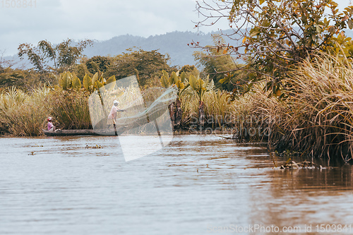 Image of Native Malagasy fishermen fishing on river, Madagascar