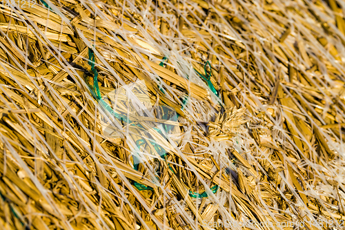 Image of large cylindrical stacks of wheat straw