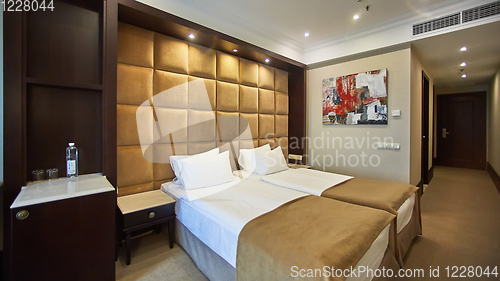 Image of Two beds in a hotel room. Interior design