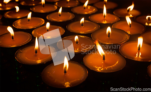 Image of Burning candles in Tibetan Buddhist temple