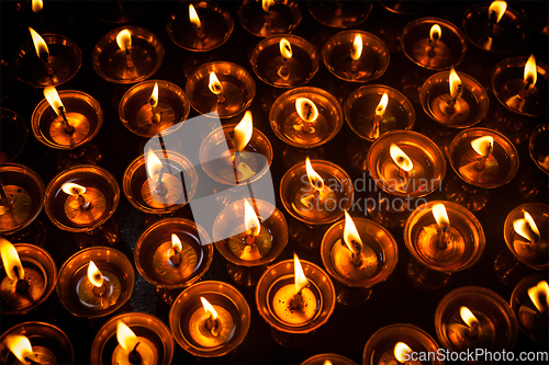 Image of Burning candles in Tibetan Buddhist temple