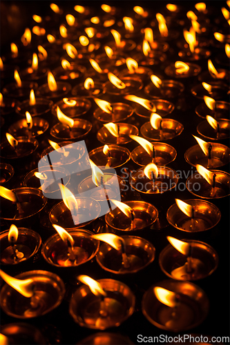 Image of Burning candles in Tibetan Buddhist temple