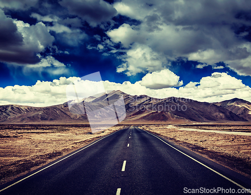 Image of Road on plains in Himalayas with mountains