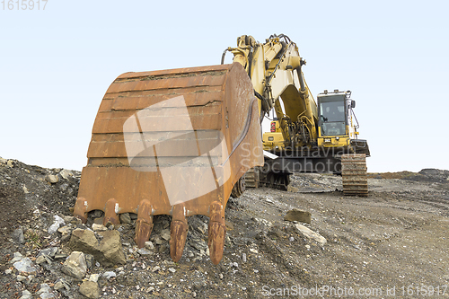 Image of Excavator in rocky ambiance