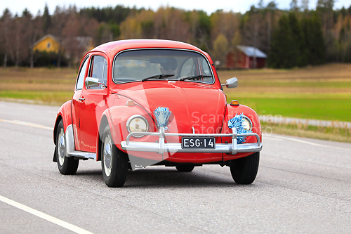 Image of 1970 Red Volksvagen Beetle Car on Road