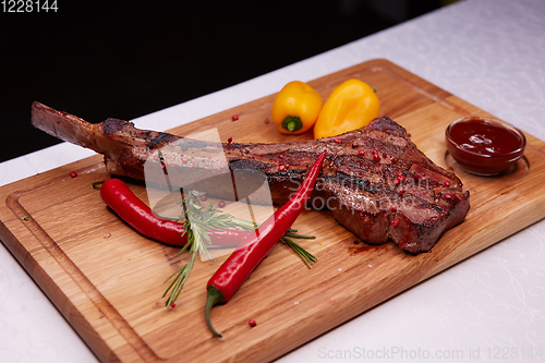 Image of The Barbecue Tomahawk Steak on Cutting Board