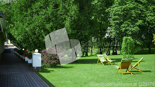 Image of Rest chairs in the garden. Resort concept