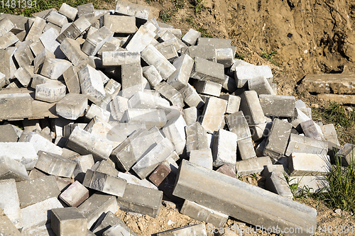 Image of pile of old concrete paving slabs