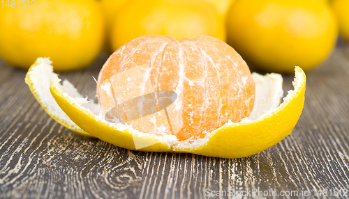 Image of peeled orange juicy tangerine