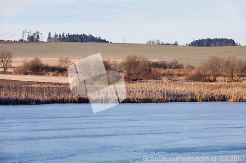 Image of rural landscape with frozen small pond