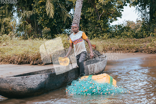 Image of Native Malagasy fishermen fishing on river, Madagascar