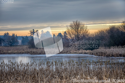 Image of rural landscape with frozen small pond