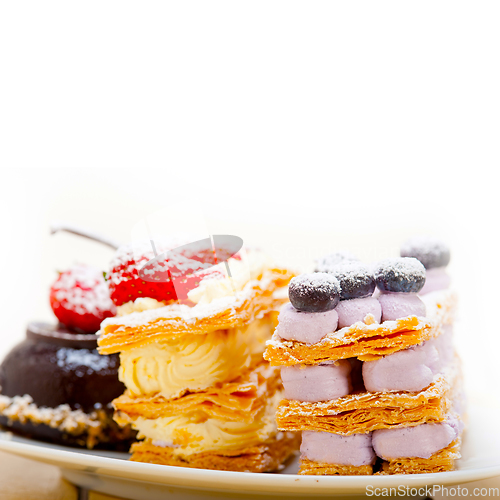 Image of selection of fresh cream cake dessert plate