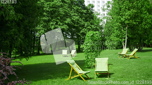 Image of Rest chairs in the garden. Resort concept