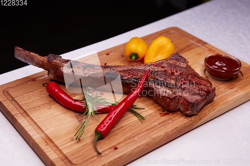 Image of The Barbecue Tomahawk Steak on Cutting Board