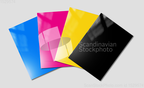 Image of CMYK booklets set mockup on grey background