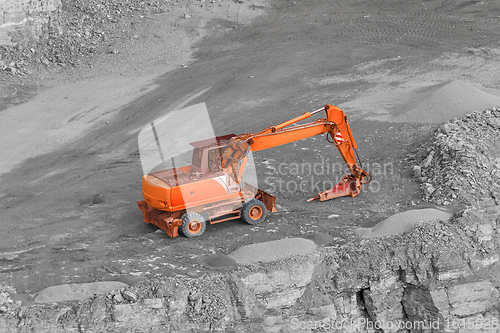 Image of Excavator in rocky ambiance