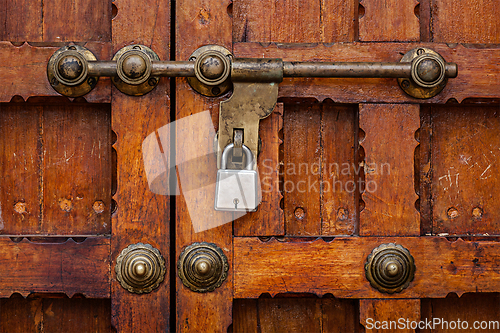 Image of Latch with padlock on door